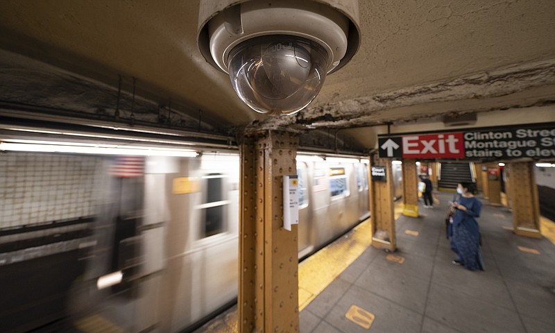 FILE - In this Oct. 7, 2020, file photo, a video surveillance camera is installed on the ceiling above a subway platform in the Court Street station in the Brooklyn borough of New York. State lawmakers across the U.S. are reconsidering the tradeoffs of facial recognition technology amid civil rights and racial bias concerns. (AP Photo/Mark Lennihan, File)