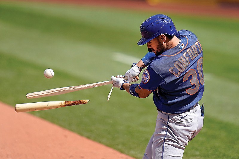 Michael Conforto of the Mets hits a broken-bat single during the eighth inning of Thursday afternoon's game against the Cardinals at Busch Stadium.
