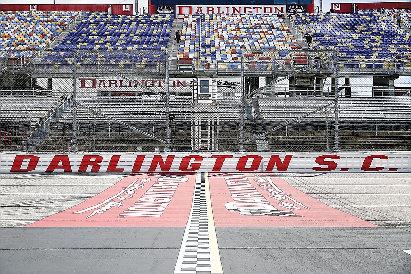 In this May 17, 2020, file photo, the grandstands are empty at Darlington Raceway before a NASCAR Cup Series race in Darlington, S.C.