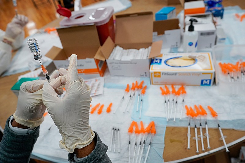 In this April 8, 2021, file photo, a Northwell Health registered nurses fills a syringe with the Johnson and Johnson COVID-19 vaccine at a pop up vaccination site at the Albanian Islamic Cultural Center in the Staten Island borough of New York.