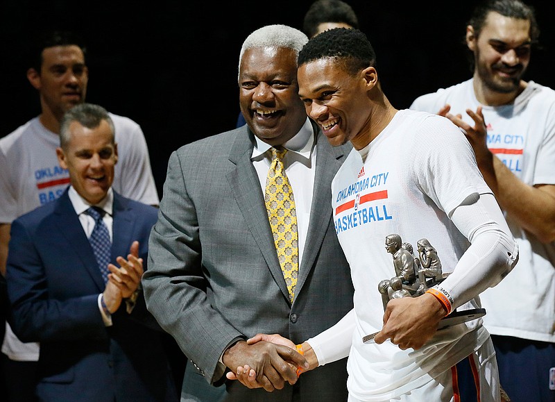 Then-Oklahoma City Thunder guard Russell Westbrook, right, is congratulated by Oscar Robertson on his single season triple-double record before an NBA basketball game between the Denver Nuggets and the Oklahoma City Thunder in Oklahoma City, Okla., in this Wednesday, April 12, 2017, file photo. Westbrook's stat lines have been looking like typos in the box score lately, and now he's on the verge of something historic. The Washington Wizards point guard's next triple-double  which could come as soon as Saturday, May 8, 2021, will be the 181st of his career, tying Oscar Robertson's NBA record. (AP Photo/Sue Ogrocki, File)