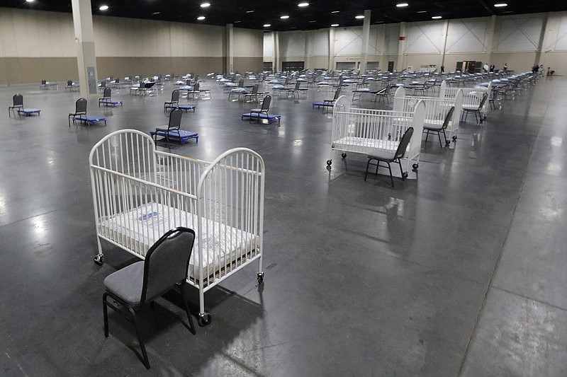 In this Monday, April 6, 2020 file photo, cots and cribs are arranged at the Mountain America Expo Center in Sandy, Utah, as an alternate care site or for hospital overflow amid the COVID-19 pandemic. According to a government report released on Wednesday, May 5, 2021, the U.S. birth rate fell 4% in 2020, the largest single-year decrease in nearly 50 years. The rate dropped for moms of every major race and ethnicity, and in nearly every age group, falling to the lowest point since federal health officials started tracking it more than a century ago. (AP Photo/Rick Bowmer)