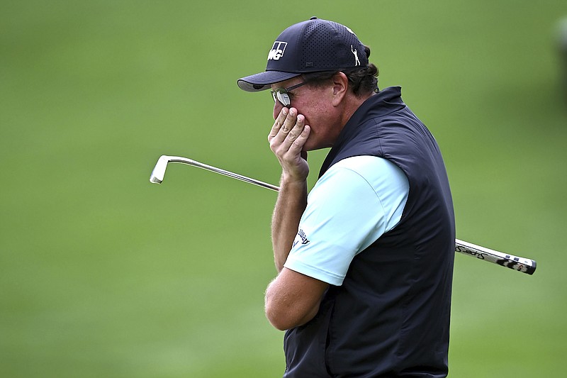 Phil Mickelson reacts after missing a putt on the 15th green during Friday's second round of the Wells Fargo Championship at Quail Hollow Club in Charlotte, N.C.