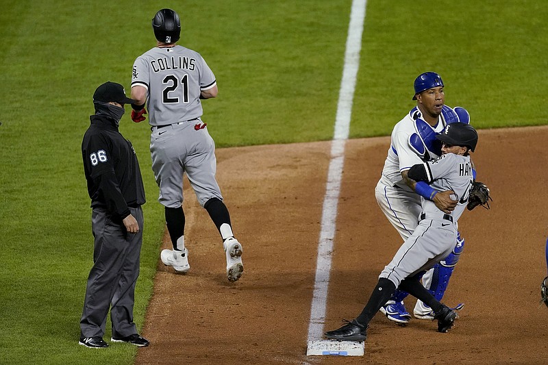 Royals catcher Salvador Perez catches Billy Hamilton of the White Sox after colliding with him while chasing Zack Collins back to third as Collins tried to score on a ball hit by Nick Madrigal during the seventh inning of Friday night's game at Kauffman Stadium.