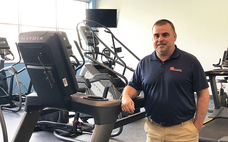 Fulton Parks and Recreation Director Clay Caswell stands next to a treadmill on Thursday in the cardio room at the City of Fulton Legends Rec Plex.