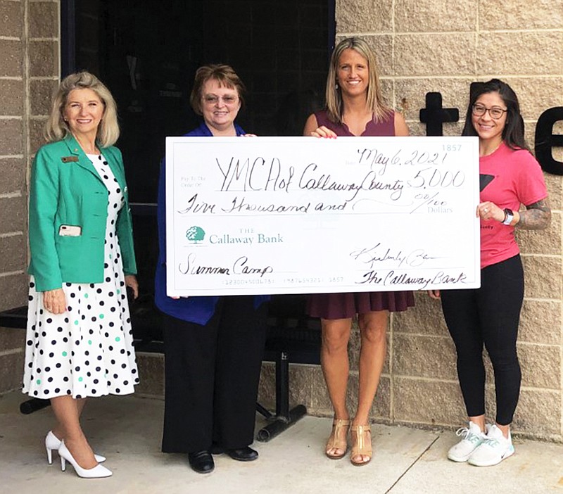 From left are Debbie LaRue, director of public relations and vice president of The Callaway Bank; Kim Barnes, president and CEO of The Callaway Bank; Sara McDaniel, CEO of the YMCA of Callaway County, and Cecilia Portillo, YMCA sports and recreation director. The Callaway Bank presented the YMCA with a check for $5,000 on Thursday as the sponsor for the organization's summer camp June 1-Aug. 13.