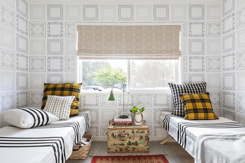 This image released by Portland Oregon-based interior designer Max Humphrey shows a room with a wallpaper design inspired by  bandanas. (Christopher Dibble via AP)