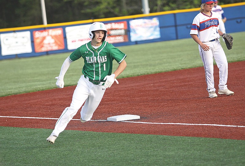 Dylan Hair of Blair Oaks rounds third base and heads toward home plate to score the go-ahead run in the top of the ninth inning of Monday's game against California at California.