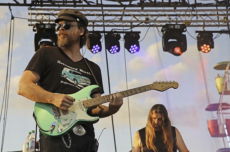 Greta Cross / News TribuneLead guitarist Jack Gue of the Five Turn Knot looks off into the crowd during the band’s performance during the 2019 Jefferson City Jaycees Cole County Fair. The band specializes in FM radio rock, country and pop hits.