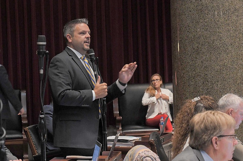 <p>Rep. Justin Hill, R-Lake St. Louis, speaks against the passage of SB 63 as Sen. Holly Rehder, a Sikeston Republican who has sponsored the prescription drug monitoring program bill for the last nine years, watched from the side gallery.</p>