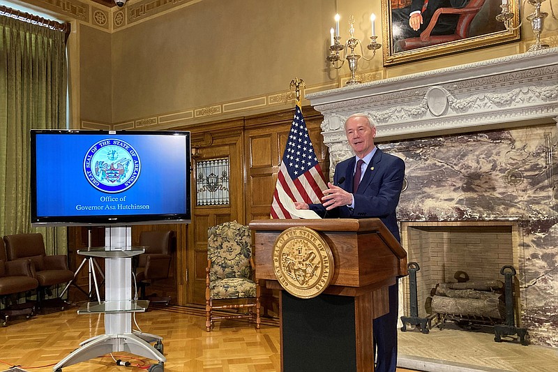 FILE — Arkansas Gov. Asa Hutchinson speaks to reporters at the state Capitol in Little Rock in this May 11, 2021 file photo. (AP/Andrew Demillo)