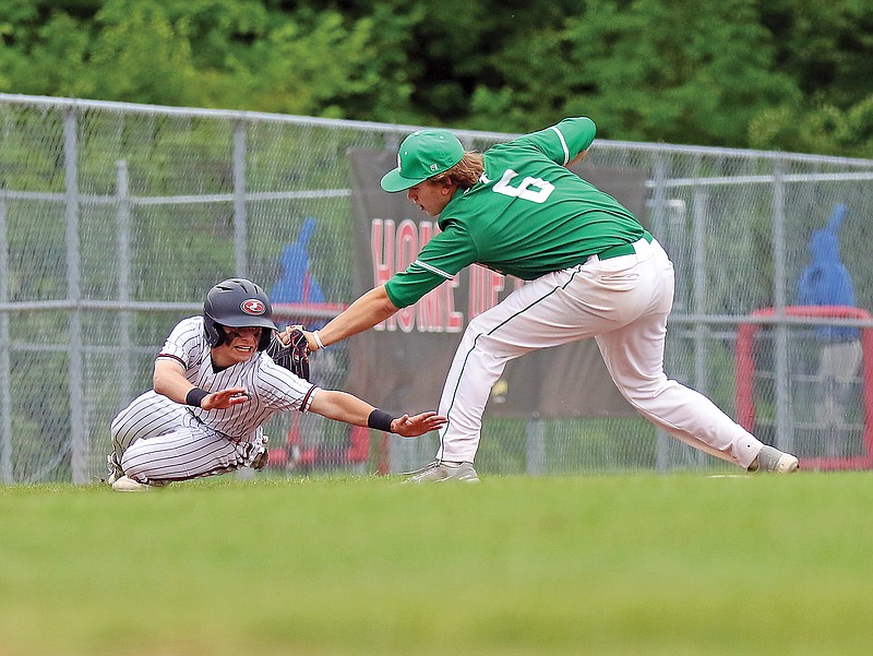 Blair Oaks third baseman Josh Isaacs reaches to tag out Jeremy Parks of Jefferson City during Tuesday's game at Vivion Field.