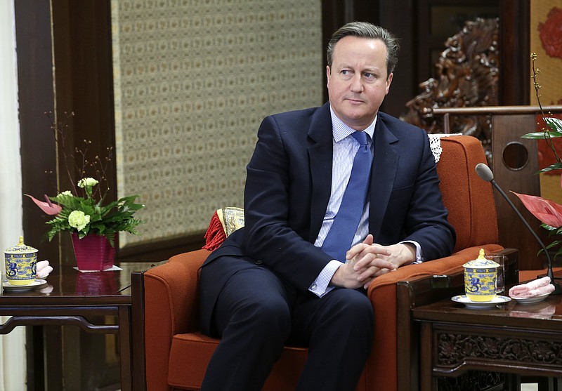 FILE - In this Tuesday, Nov. 27, 2018 file photo, former British Prime Minister David Cameron meets China's Premier Li Keqiang at Zhongnanhai leadership compound, in Beijing, China. Cameron says he never suspected that a financial services company that he lobbied for would go under, threatening thousands of jobs at a steel firm it helped finance. Cameron was summoned Thursday, May 13, 2021 to answer lawmakers’ questions about his efforts to win government funds for Greensill Capital, which collapsed in March(Jason Lee/Pool Photo via AP, file)
