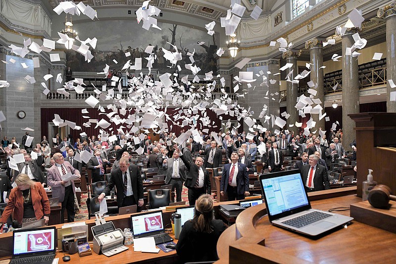 The Missouri Legislature throws paper in the air Friday after completing its final day of session.
