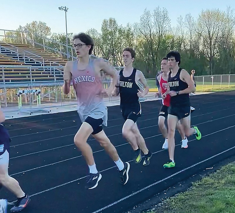 Fulton senior Isaac Avery (right) trails Fulton junior Shaun Wolfe in a meet earlier this year.
