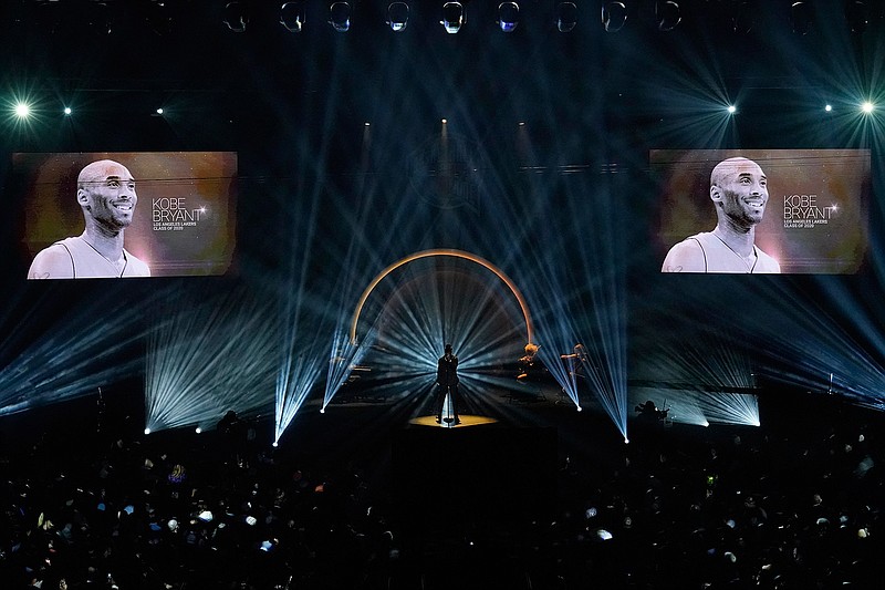 The late Kobe Bryant is honored, as are others who have died, as Ne-Yo sings "Incredible" during the 2020 Basketball Hall of Fame enshrinement ceremony Saturday, May 15, 2021, in Uncasville, Conn. (AP Photo/Kathy Willens)