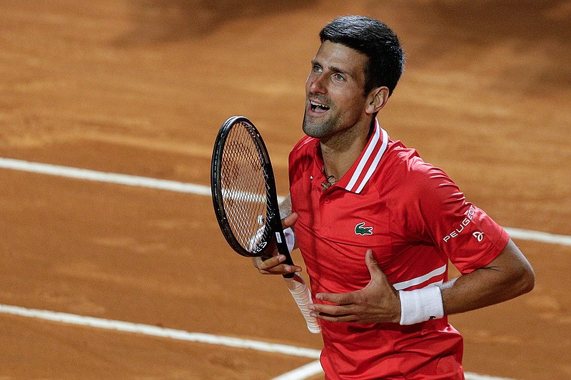 Serbia's Novak Djokovic celebrates after beating Italy's Lorenzo Sonego in their semi-final match at the Italian Open tennis tournament, in Rome, Saturday, May 15, 2021. Djokovic won 6-3 6-7 6-2 and will play Rafael Nadal in the final. (AP Photo/Gregorio Borgia)