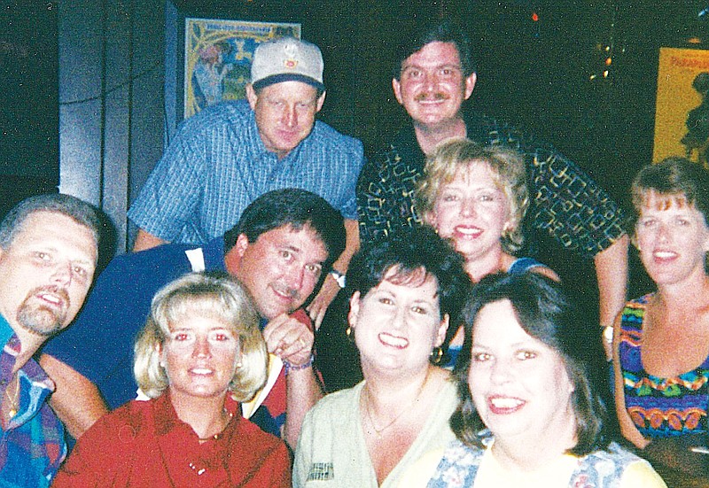 John Moore, top right, attending one of his high school class reunions.