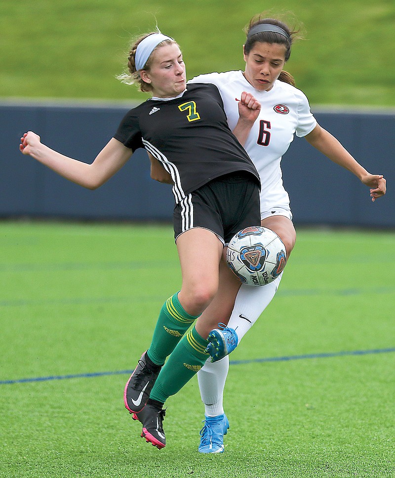 Rock Bridge's Carsyn Osborn and Jefferson City's Izzy Schmidt battle for possession during Tuesday's Class 4 District 9 semifinal game at the Crusader Athletic Complex.