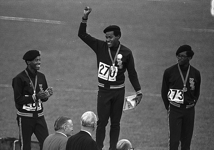  United States runners Larry James, left, Lee Evans, center, and Ron Freeman are shown after receiving their medals for the 400-meter race at the Mexico City Games in Mexico City, in this Oct. 18, 1968, file photo. Evans won gold, James took silver and Freeman got the bronze medal. Lee Evans, the record-setting sprinter who wore a black beret in a sign of protest at the 1968 Olympics, died Wednesday, May 19, 2021. He was 74. USA Track and Field confirmed Evans' death. The San Jose Mercury News reported that Evans' family had started a fundraiser with hopes of bringing him back to the U.S. from Nigeria, where he coached track, to receive medical care after he suffered a stroke last week.(AP Photo/File)