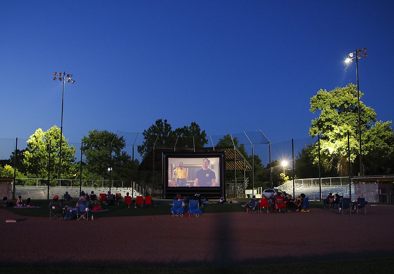 Liv Paggiarino/News Tribune photo: 

Stars Under the Stars presents “Playing with Fire” on Friday at Vivion Field. Vivion Field was a new location for the outdoor movie event. Small groups brought out their popcorn, blankets and lawn chairs to watch the movie under the stars.