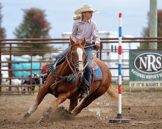 <p>Submitted photo</p><p>Bella Fulks competes in a pole bending event. Fulks, 12, qualified for the National Junior High School Rodeo Association Finals.</p>