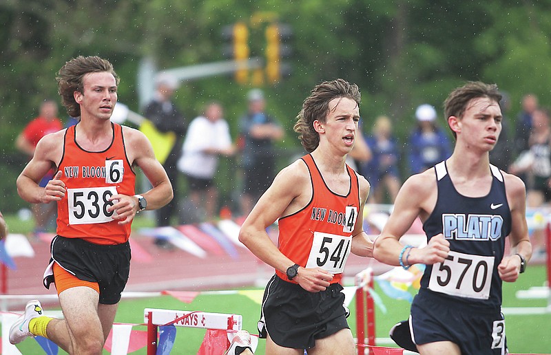 <p>Greg Jackson/FULTON SUN</p><p>New Bloomfield’s Nathan Hinrichs, center, and Caleb Distler, left, run side-by-side during the boys 3,200-meter run Friday in the Class 2 state track and field champinships at Adkins Stadium in Jefferson City.</p>