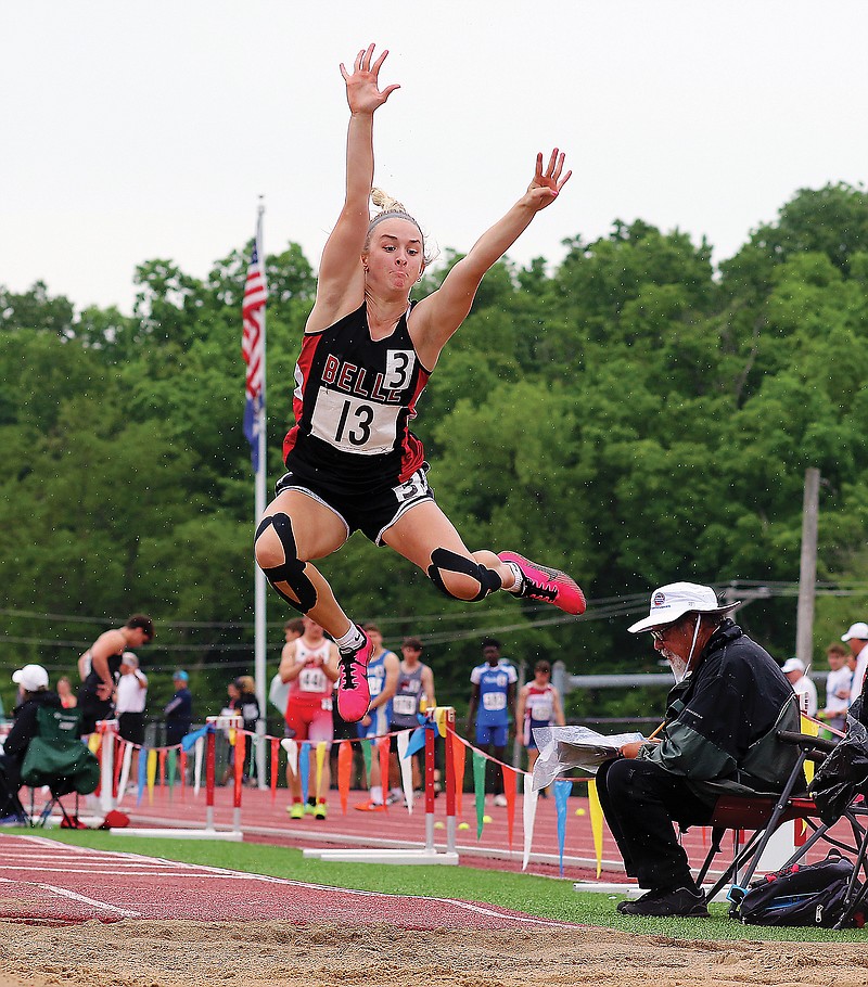 Gracie Schultz of Belle flies into the sand pit during the long jump Friday in the Class 2 state track and field championships at Adkins Stadium. 