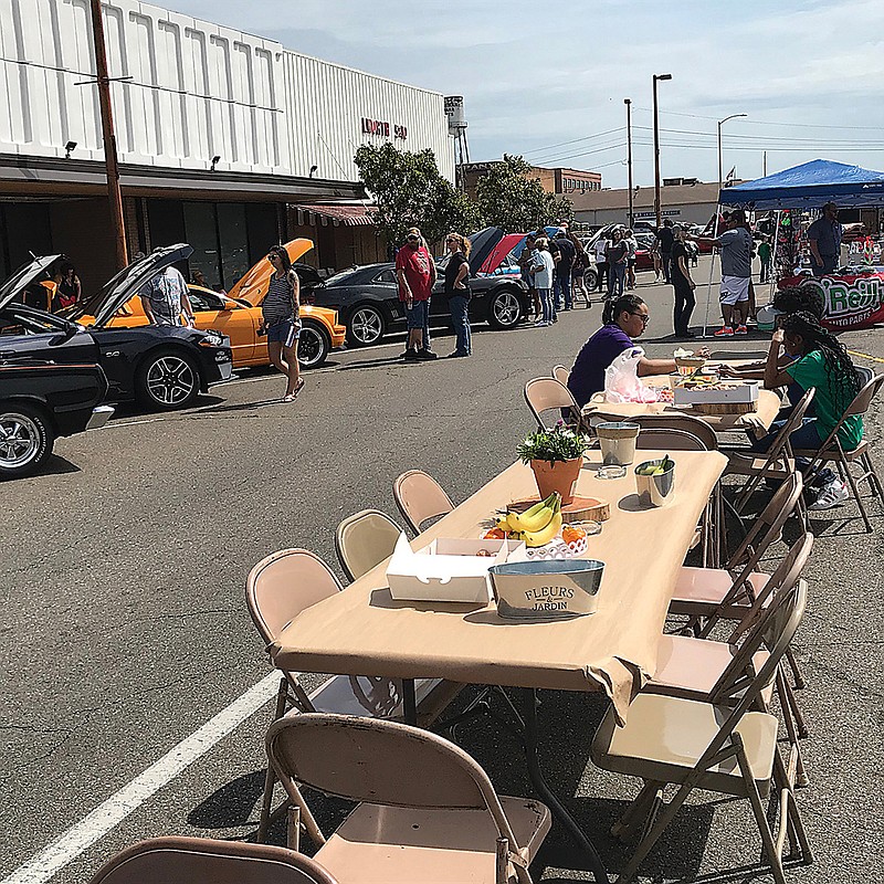 Local and area residents started gathering on East Broad Street Saturday morning for the "Just Love and Kindness" benefit fundraiser. The event was held to generate proceeds for the Texarkana Arkansas School District. It featured a vintage car show and eight local amateur barbecue providers.