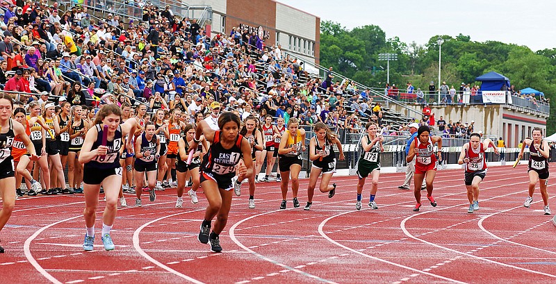 Runners, including Calvary Lutheran's Baileigh Morris (26), take off to start the 4x800-meter run Saturday in the Class 1 state track and field championships at Adkins Stadium.