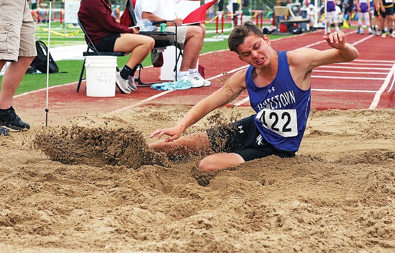 Jamestown's Zach Hargis lands in the sand to record a mark in the long jump Saturday in the Class 1 state track and field championships at Adkins Stadium.