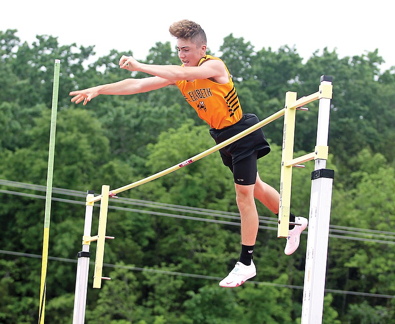 St. Elizabeth's Kade Wright lets go of his pole as he makes his way over the bar on a successful attempt in the boys pole vault Saturday during the Class 1 state championships at Adkins Stadium.