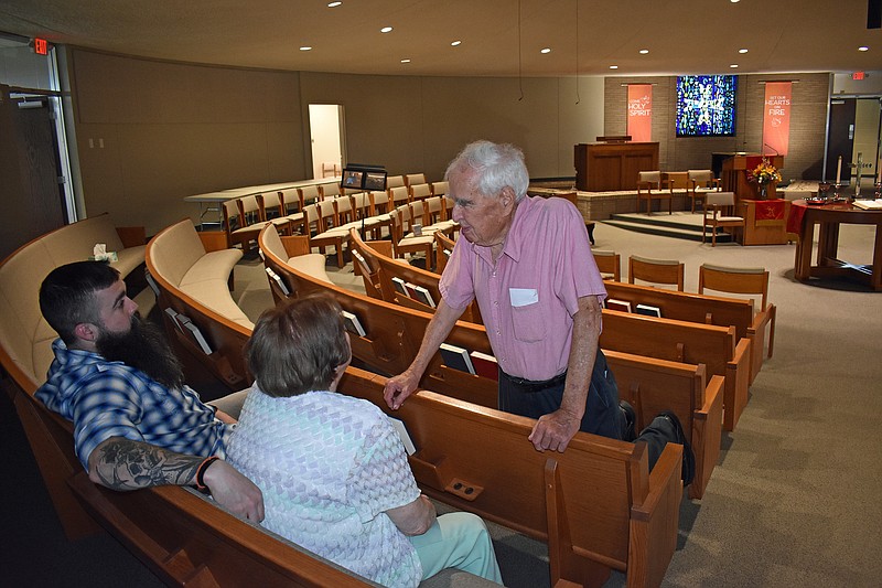 Gerry Tritz/News TribuneFrom left, Ryan Thomas, his grandmother Joyce Hoskins and Milt Hoskins chat in the chapel of Community Christian Church's chapel after the church's Sunday afternoon rededication ceremony. Thomas' biological grandfather was a pastor at the church many years ago.