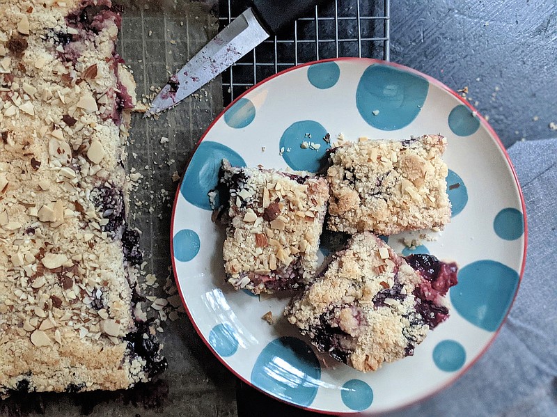 A mix of blueberries and chopped strawberry offer a taste of summer in these easy crumble bars. (Gretchen McKay/Pittsburgh Post-Gazette/TNS)