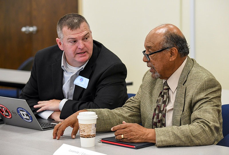 Gary Verslues, left, and Michael Couty take part in the Community Resource Coordinating Committee meeting Tuesday, May 25, 2021, at the Jefferson City Police Department Training Room. Verslues is assistant superintendent of Jefferson CIty School District while Couty is the longtime director of the Prenger Center who is retiring soon.