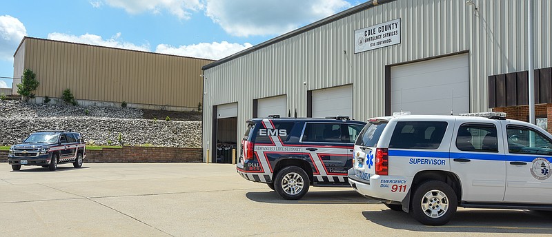 Julie Smith/News Tribune
Cole County EMS Battalion Chief Gretchen Bodley drives out of the garage bay at the Southridge Drive location. In the foreground are two other EMS vehicles which may be the one that pulls in your driveway for a medic to administer a Covid-19 vaccine to a homebound Cole County resident. Working through the Cole County Health Dept. and traveling in a SUV, staff from Cole County EMS have vaccinated a number county residents who are unable to leave their home at this time.