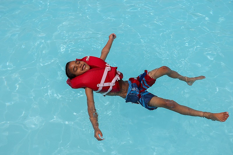 In this News Tribune file photo, Jaden Woodard, 5, floats in the water at Ellis-Porter Riverside Pool on a warm Friday, June 5, 2020. 