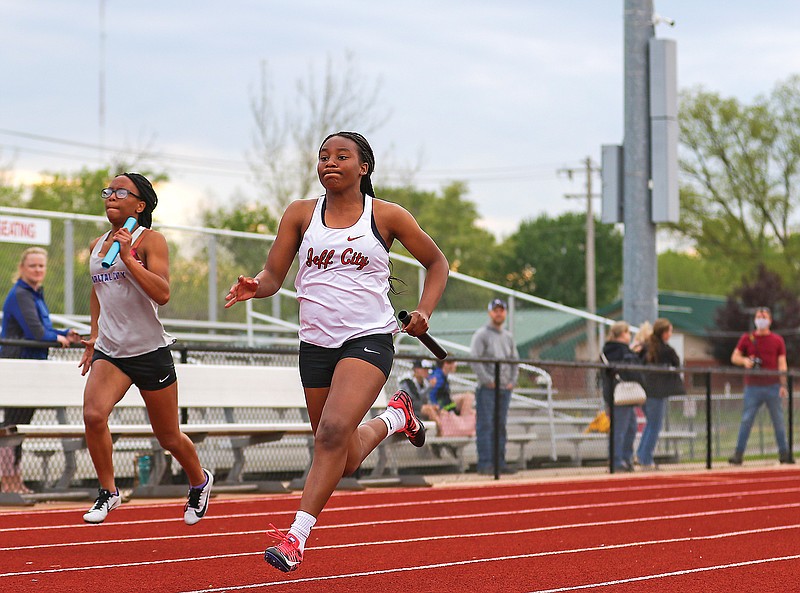 Emmarie Graham of Jefferson City sprints across the track while competing in a relay event during a track quad earlier this season at Adkins Stadium.