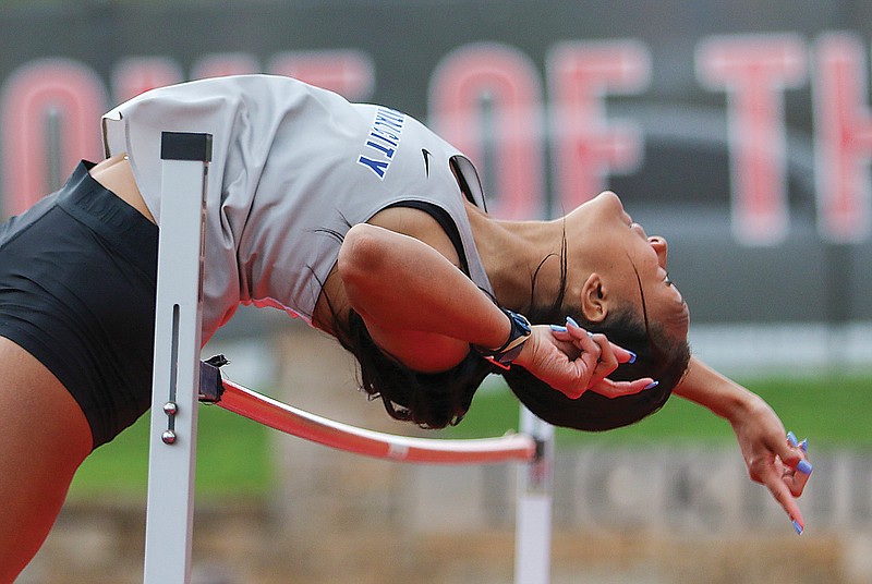 Kiara Strayhorn successfully clears the bar while competing in the high jump during a track quad earlier this season at Adkins Stadium.