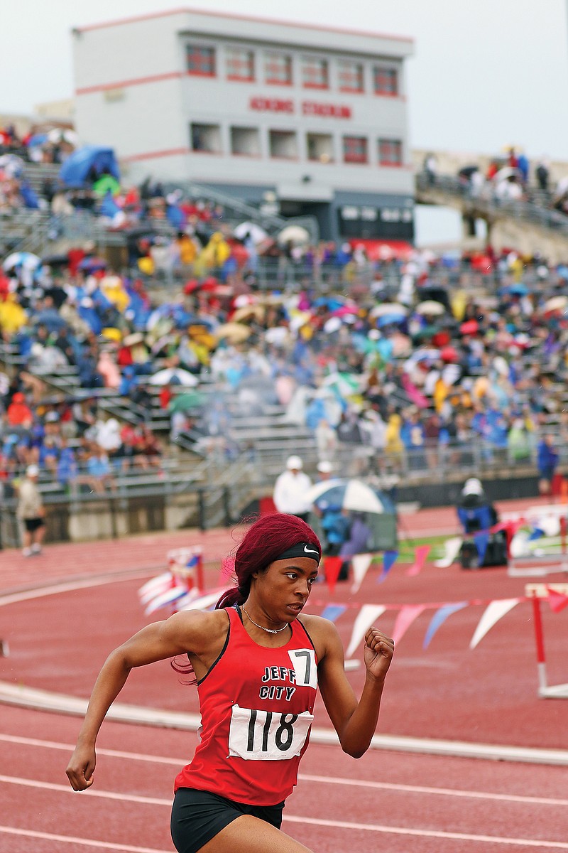 Dijonay Dawson of Jefferson City rounds the first turn during the 400-meter dash Thursday in the Class 5 state track and field championships at Adkins Stadium.