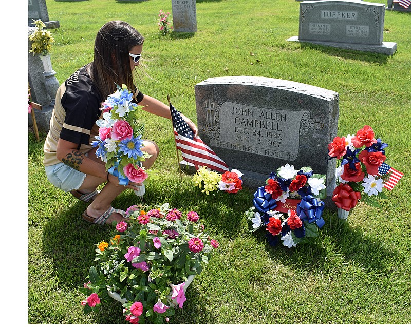 Gerry Tritz/News Tribune
Ashley Shannon visits the grave of her uncle John Allen Campbell, who was honored during a Sunday ceremony hosted by Silver Star Families. Campbell was a Marine who was killed in Vietnam in 1967.