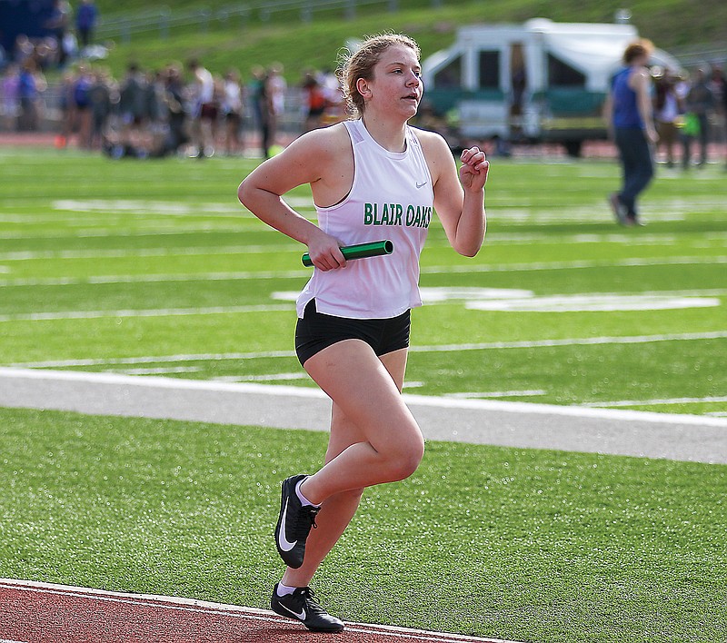 Natalie Heckman of Blair Oaks runs in the 4x800-meter relay during the Blair Oaks Invitational earlier this season at the Falcon Athletic Complex. 