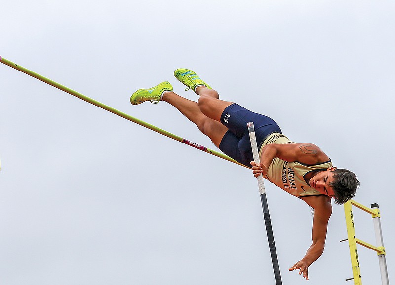 Dominic Crisostomo of Helias clears the bar while competing in the boys pole vault Friday in the Class 4 state track and field championships at Adkins Stadium. Crisostomo won the state title by clearing 15 feet, .75 inches.