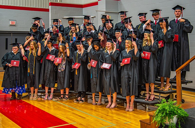 The Calvary Luthern High School Class of 2021 move their tassles after receiving their diplomas Saturday.  This is the 13th class to graduate from Calvary Lutheran. (Ken Barnes/News Tribune)