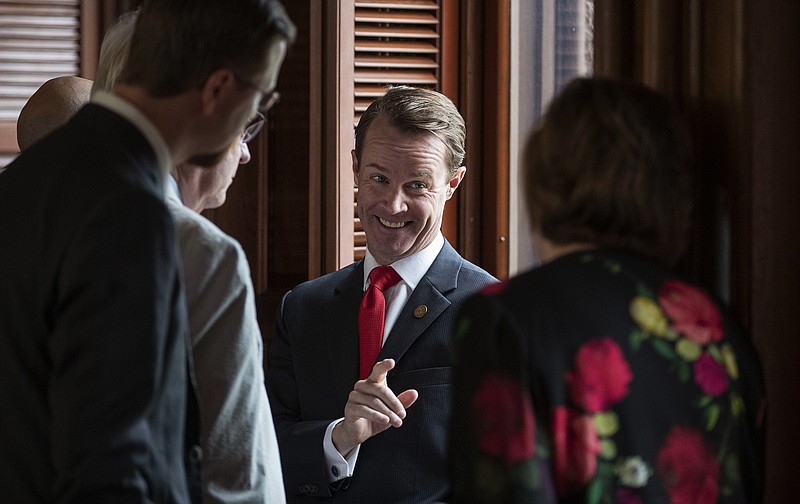  House Speaker Dade Phelan, R-Beaumont, talks to Republican members of the Texas House on Sunday before the start of the debate of Senate Bill 7, known as the Election Integrity Protection Act, at the Capitol in Austin.