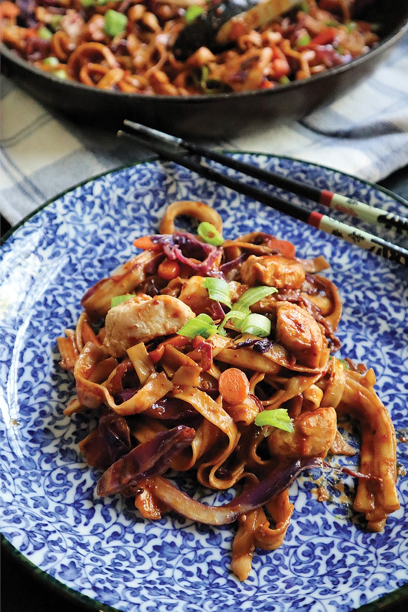 Lo mein noodles tossed in a spicy peanut sauce get an extra boost from tender chunks of chicken. (Gretchen McKay/Post-Gazette/TNS)