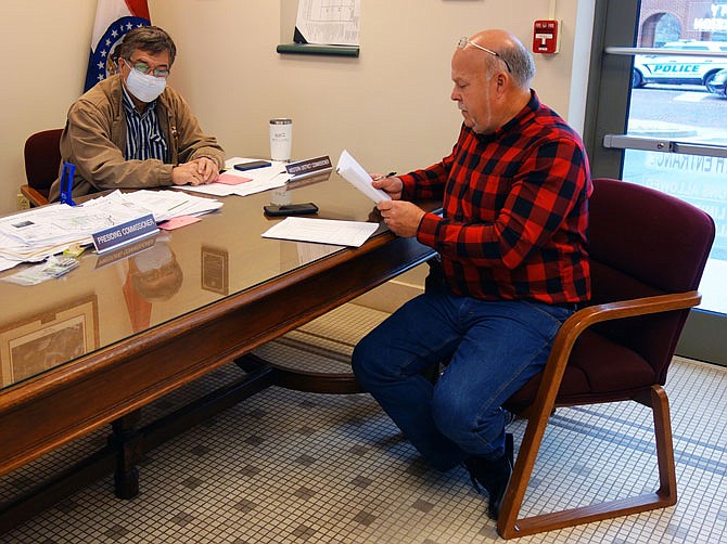 FILE: Callaway County Presiding Commissioner Gary Jungermann, right, and Western District Commissioner Roger Fischer work on the county's 2021 budget in December. Jungermann announced during Tuesday's community update that Callaway has received the first half of its America Rescue Plan Act funding, totaling $4.3 million.