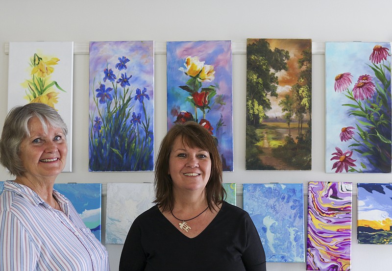 Liv Paggiarino/News Tribune

Janis Burgen and Penny Jarden stand for a portrait in front of one of the several colorful walls of paintings at The Art Gallery-Studio on Tuesday. The art space opens on June 12 and will feature classes on several mediums of art, including painting, crafting, beading and glass fusing. 
