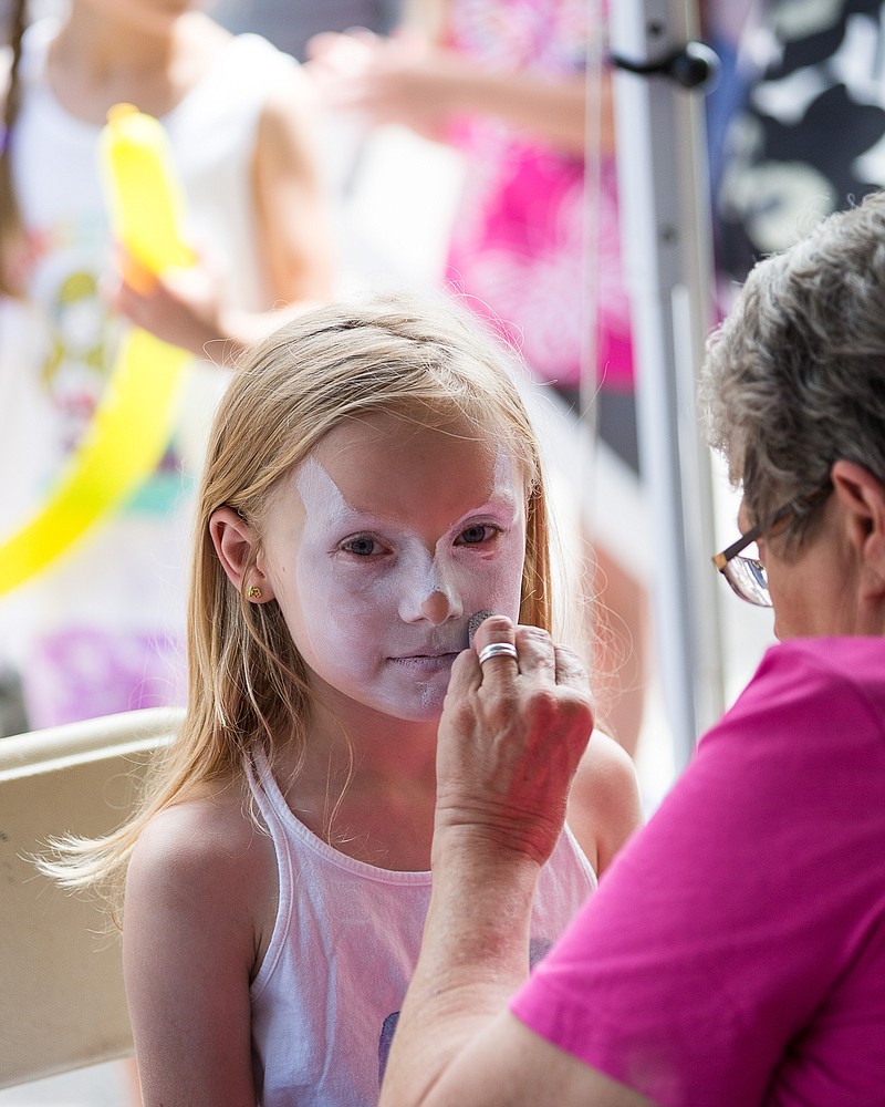 FILE photo: Lilliam Theis gets her face painted at a past year's KidsFest in downtown Jefferson City. The event, which had to be canceled the last two years, returns Saturday — this time at Riverside Park.  