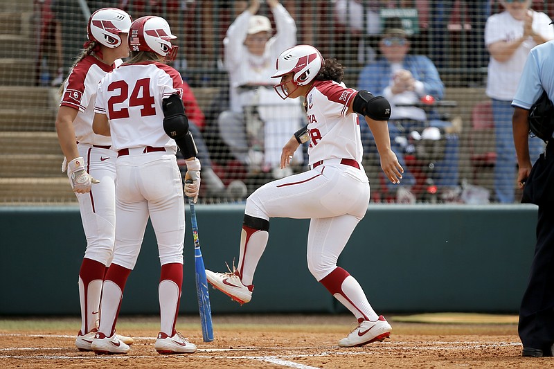 Oklahoma's Jocelyn Alo steps on home plate after hitting a home run against Washington last Thursday during an NCAA Tournament game in Norman, Okla.